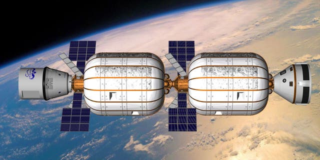 An artist's illustration of two privately built Bigelow Aerospace B330 expandable habitats joined together in Earth orbit.
