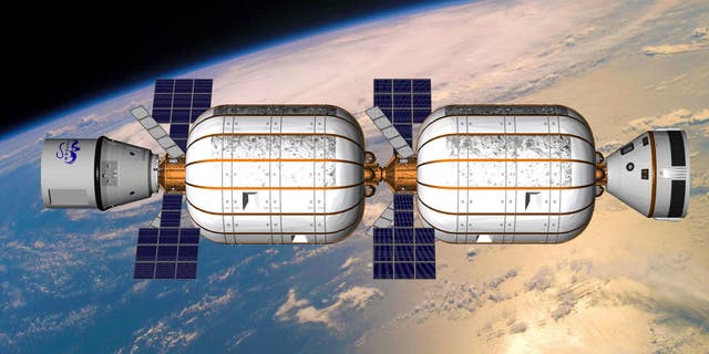 An artist's illustration of two privately built Bigelow Aerospace B330 expandable habitats joined together in Earth orbit.