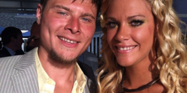 Kevin Adorno, 28, seen here with girlfriend, reportedly stopped at a restaurant Monday night and was talking to his girlfriend on a cellphone when he was attacked.