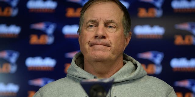 FOXBOROUGH, MA - JULY 29: New England Patriots head coach Bill Belichick speaks at a press conference at Gillette Stadium July 29, 2015 in Foxborough, Massachusetts. Belichick was asked about NFL Commissioner Roger Goodell's decision to uphold a four game suspension for quarterback Tom Brady for his role in using underinflated balls in the AFC Championship game in 2014. (Photo by Darren McCollester/Getty Images)