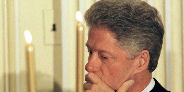 US President Bill Clinton waits his turn to speak at a dinner for the White House Endowment Fund January 21, 1998.