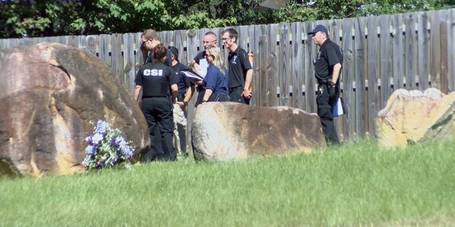 Investigators search the area where Ashanti Billie's body was found Friday morning in Charlotte.