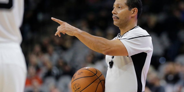 NBA referee Bill Kennedy (55) during the second half of an NBA basketball game between the San Antonio Spurs and Utah Jazz, Monday, Dec. 14, 2015, in San Antonio. Kennedy has told Yahoo Sports he is gay after Sacramento Kings guard Rajon Rondo directed a gay slur at him during a game. Kennedy tells Yahoo he is "proud to be an NBA referee and I am proud to be a gay man," adding that he chose to come out in hopes of sending a message "that you must allow no one to make you feel ashamed of who you are." (AP Photo/Eric Gay)