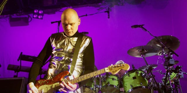 Billy Corgan, lead singer for the Smashing Pumpkins, performs during the bands final show December 2, 2000 at the Metro Theatre in Chicago. The band, which got its start playing at the venue, is splitting up after 13 years and 17 million albums sold. - RTXK61O