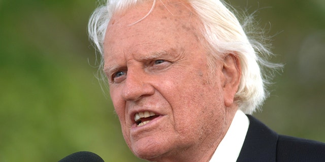 In this June 26, 2005 file photo, the Rev. Billy Graham speaks on stage on the third and last day of his farewell American revival.