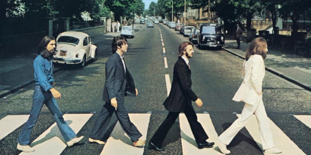 In Monday's video, McCartney strayed from donning the same dark suit he wore in the original photo.