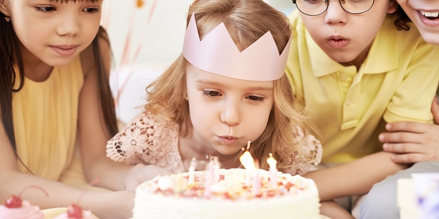A group of children are having fun at a birthday party. "Your daughter has every right to feel safe" at her own party, said one commenter to the Reddit poster about how her daughter (not pictured) had experienced bullying.