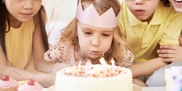 A group of children are having fun at a birthday party. "Your daughter has every right to feel safe" at her own party, said one commenter to the Reddit poster about how her daughter (not pictured) had experienced bullying.