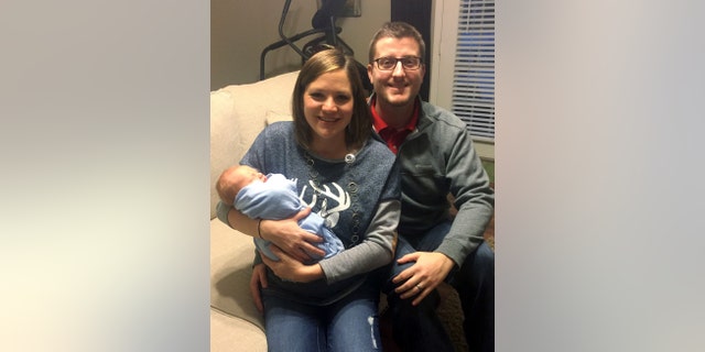 In the photo taken Dec. 24, 2016, by Luke Gardner with his cell phone on a timer, Luke and Hillary Gardner pose with their son Cade Lee in Baldwyn, Miss. The husband and wife share the same birthday, and now also their son who was born on Dec. 18. The odds of that happening are about one in 133,000 statisticians say. (Luke Gardner via AP)