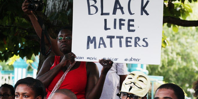 A demonstration on Thursday, Aug. 14, 2014, in Decatur, Georgia,