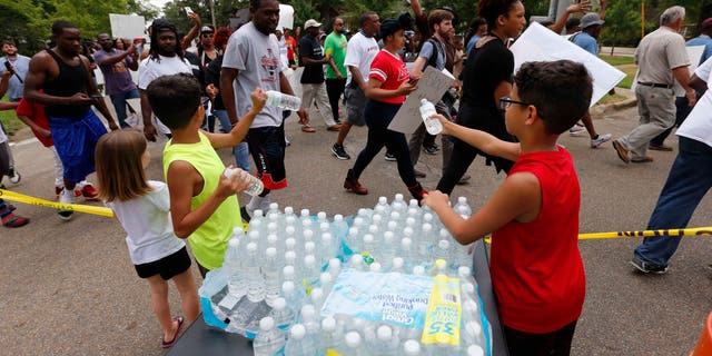 Community march in North Green Street in Tupelo, Miss., on Saturday, July 30, 2016.