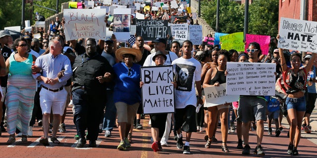 People march in a Black Lives Matter rally in Oklahoma City, Oklahoma.
