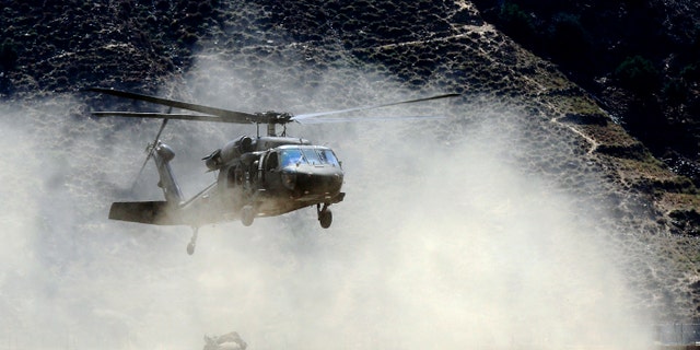 File photo - A U.S. Army Black Hawk helicopter lands at FOB Bostick in eastern Afghanistan's Naray district, Kunar province August 23, 2011. (REUTERS/Nikola Solic)