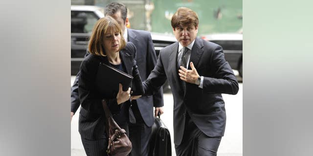 Former Illinois Gov. Rod Blagojevich and his wife Patti Blagojevich arrive at federal court for final jury selection and opening arguments in his second corruption trial, Monday, May 2, 2011, in Chicago. (AP Photo/Paul Beaty)