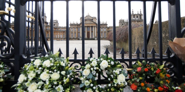 Floral tributes are seen at the gates of Blenheim Palace before the funeral of the 11th Duke of Marlborough, John Spencer-Churchill, in Woodstock, southern England October 24, 2014. His Blenheim Palace home is a Unesco World Heritage Site, and the birthplace of Winston Churchill.