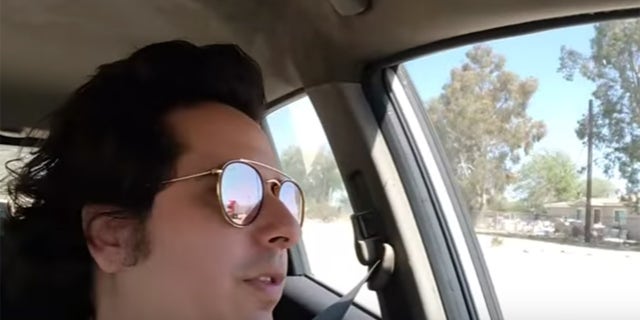 The reflection of the truck can be seen in Slavitt's glasses just before impact.