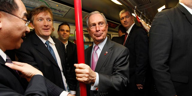 FILE: In this Nov. 6 picture, New York City Mayor Michael Bloomberg rides on the Mass Transit Railway, an underground train in Hong Kong, during a convention of large city leaders who met to discuss climate change.