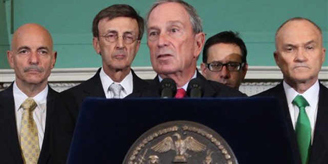 New York City Mayor Michael Bloomberg, center, addresses the media Aug. 25 in New York.