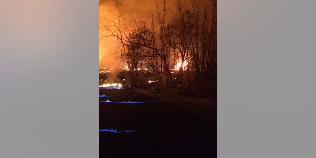 Methane produced by buried and burning vegetation ignited to create a blue flame in the volcano's Lower East Rift Zone, officials said.