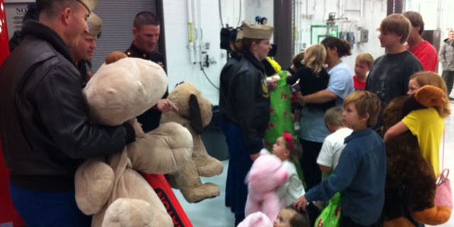 Nov. 22, 2011: Blue Angels bring gifts to children displaced by tornadoes.