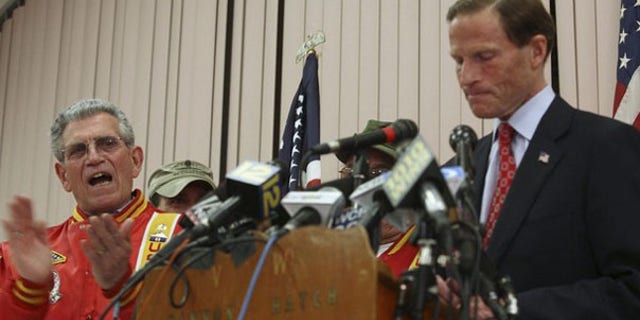 Connecticut Attorney General Richard Blumenthal, right, addresses allegations that he lied about serving in Vietnam during a news conference in West Hartford, Conn., May 18. (Reuters Photo)