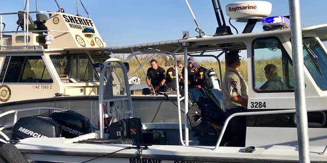 Four people were missing Sunday after a boat collision on the Colorado River ejected passengers and left nine others injured, officials said.
