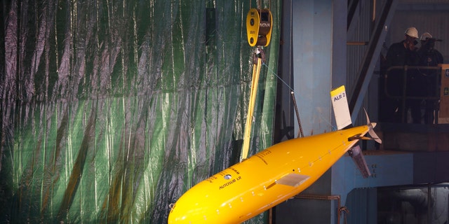 Sub 'Boaty McBoatface' hangs from a crane during the keel laying ceremony of the polar research vessel the Sir David Attenborough, at the Cammell Laird ship yard in Birkenhead, Oct. 17 , 2016. (REUTERS/Phil Noble)