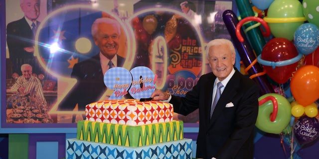 November 5, 2013.  Bob Barker posing on the set of  "The Price is Right" with a cake celebrating his 90th birthday at CBS Studios in Los Angeles. The veteran game show host, at the helm of The Price is Right from 1972 to 2007, was invited back by current host Drew Carey on Thursday, Dec. 12, to celebrate the milestone birthday.