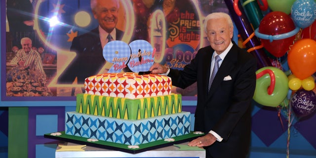 November 5, 2013. Bob Barker posing on the set of "The Price is Right" with a cake celebrating his 90th birthday at CBS Studios in Los Angeles. The veteran game show host, at the helm of The Price is Right from 1972 to 2007, was invited back by current host Drew Carey on Thursday, Dec. 12, to celebrate the milestone birthday.