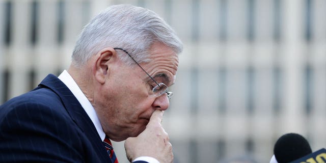 Democratic Sen. Bob Menendez pauses to compose himself before speaking to reporters in front of the courthouse in Newark, N.J., Thursday, Nov. 16, 2017.