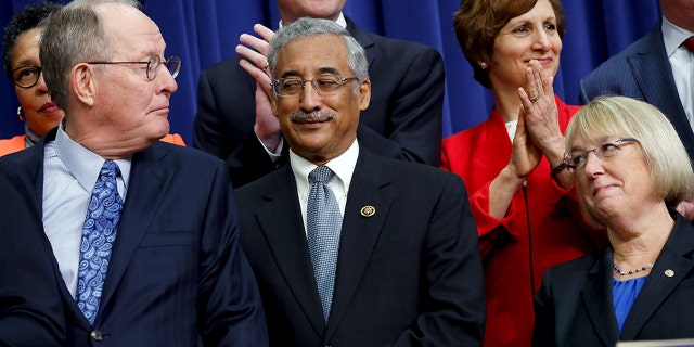 Rep. Bobby Scott, D-Va., (center, in 2015) is accused of sexually harassing a former Congressional Black Caucus fellow.