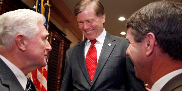Nov. 23: Virginia Gov. Bob McDonnell, center, talks with Rep. Jim Moran, D-Va., left, and Rep. Rob Wittman, R-Va., after a news conference in Arlington, Va. McDonnell said Nov. 30th Virginia state employees will not get a pay raise any time soon but on Dec. 1, more than 117,000 eligible state government workers will get a one-time bonus.