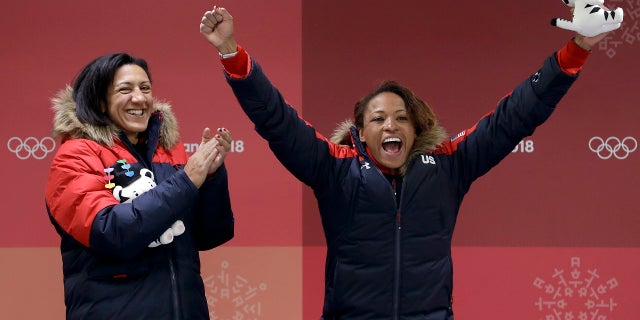 Driver Elana Meyers Taylor, left, and Lauren Gibbs, right, of the United States won silver in women's bobsled.