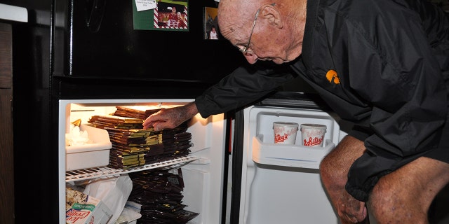 Williams, seen here, stockpiles his fridge with his weekly chocolate haul.