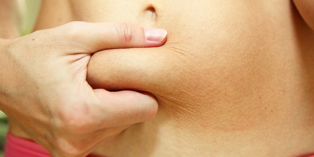 body fat belly fat woman istock