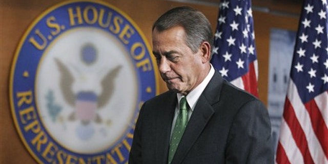 House Speaker John Boehner leaves a news conference on Capitol Hill in Washington Feb. 10.