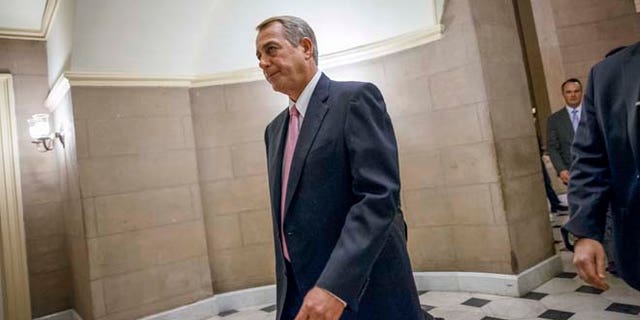 March 3, 3015: House Speaker John Boehner of Ohio walks to the House chamber on Capitol Hill in Washington.