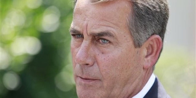 In this June 10 photo, House Minority Leader John Boehner of Ohio speaks to reporters outside the White House. (AP Photo)