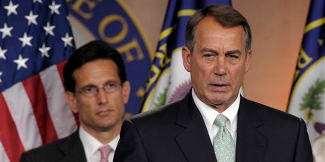 House Speaker John Boehner, right, speaks during a news conference with House Majority Leader Eric Cantor on Capitol Hill in Washington July 15.