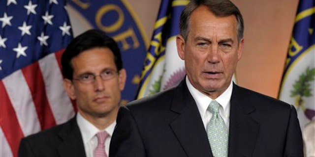 House Speaker John Boehner, right, speaks during a news conference with House Majority Leader Eric Cantor on Capitol Hill in Washington July 15.