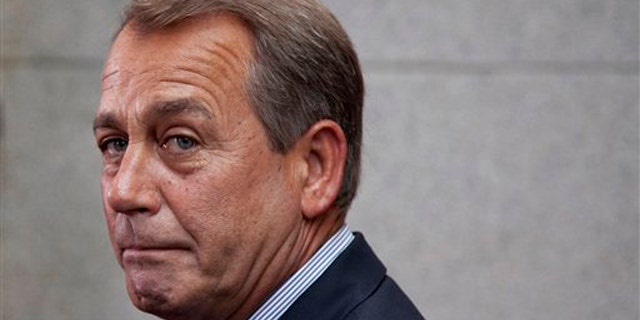 House Speaker John Boehner makes a statement after a Republican caucus meeting on Capitol Hill Sept. 8.