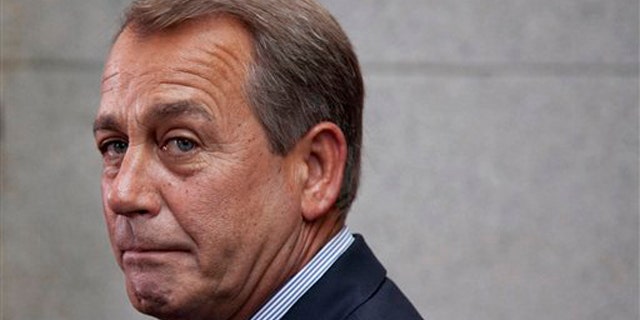 House Speaker John Boehner makes a statement after a Republican caucus meeting on Capitol Hill Sept. 8.