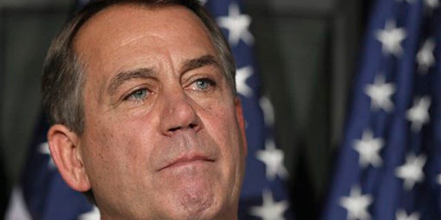 House Speaker John Boehner pauses during a news conference at The Republican National Committee on Capitol Hill in Washington July 26.