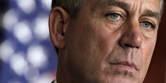 House Speaker John Boehner takes part in a news conference on Capitol Hill in Washington July 28.