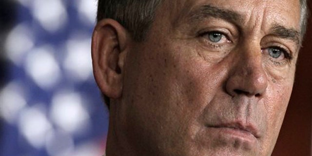 House Speaker John Boehner takes part in a news conference on Capitol Hill in Washington July 28.