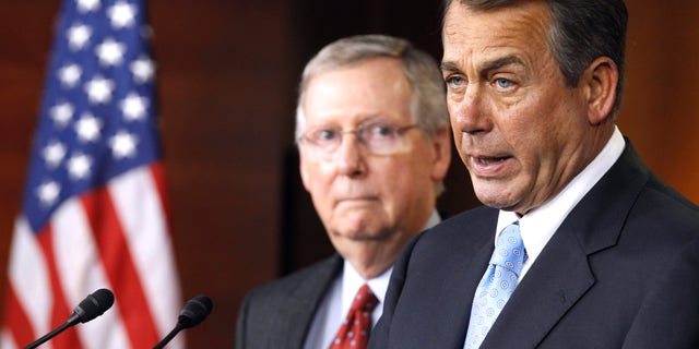 House Speaker John Boehner of Ohio, right, accompanied by Senate Minority Leader Mitch McConnell of Ky. speaks during a news conference on Capitol Hill in Washington, Wednesday, March 2, 2011. (AP)