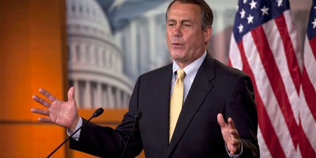 House Speaker John Boehner gestures during his weekly news briefing on Capitol Hill May 5.