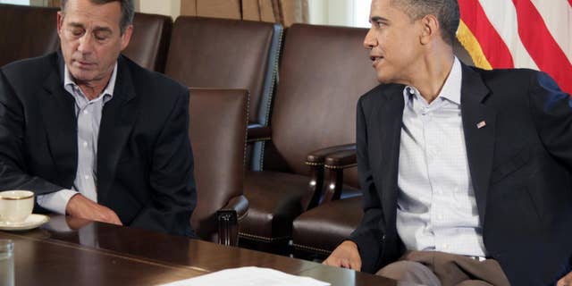 President Barack Obama meets with House Speaker John Boehner of Ohio, left, in the Cabinet Room of the White House, Saturday, July 23, 2011, in Washington, to discuss the debt. (AP Photo/Carolyn Kaster)