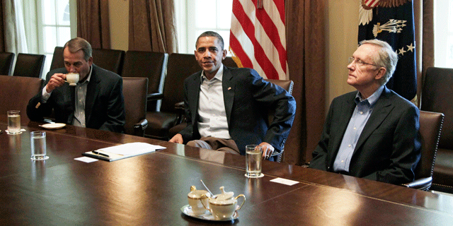 President Obama meets with Senate Majority Leader Harry Reid of Nev., and House Speaker John Boehner of Ohio, in the Cabinet Room of the White House, Saturday, July 23, 2011, in Washington, to discuss the debt.