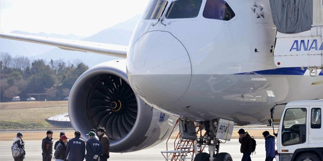 Jan. 18, 2013: In this file photo, officials inspect an All Nippon Airways Boeing 787 which made an emergency landing at Takamatsu airport in Takamatsu, western Japan.